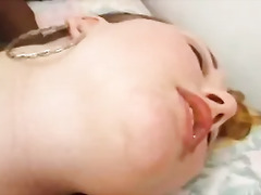 White skinned redhead loves to take big black cock in her mouth