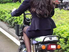 The sales lady in black pantyhose hurried to work