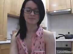 Splendid teen with glasses chatting in the kitchen